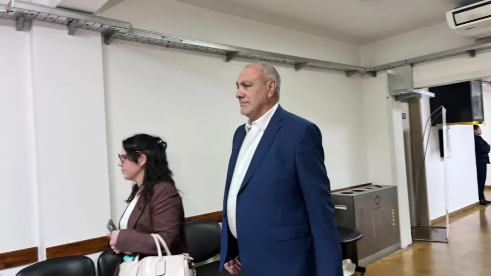 El exministro Julio Ortiz Andino ingresando a la audiencia.
